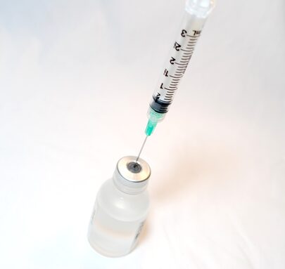 Syringe_and_Vaccine_(14329622976).jpg